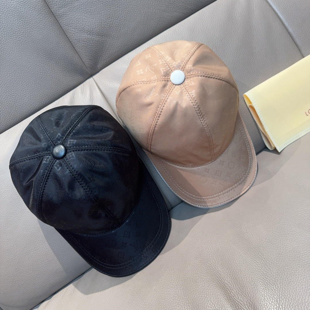 Louis Vuitton monogram baseball caps, one dark and one light, curved brim styles