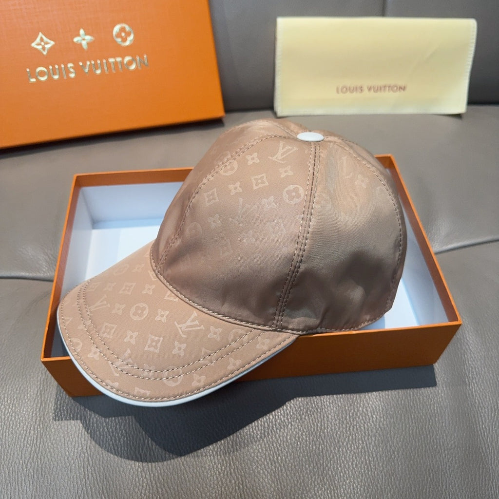 Taupe monogram baseball cap with curved brim and round snap button on top