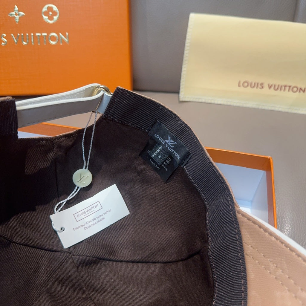 Louis Vuitton black cap with adjustable strap and hanging product tags