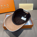 Louis Vuitton two-tone cap with tan monogram outer and dark interior lining