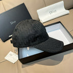 Dior baseball cap with dark monogram pattern, curved brim, and structured panels