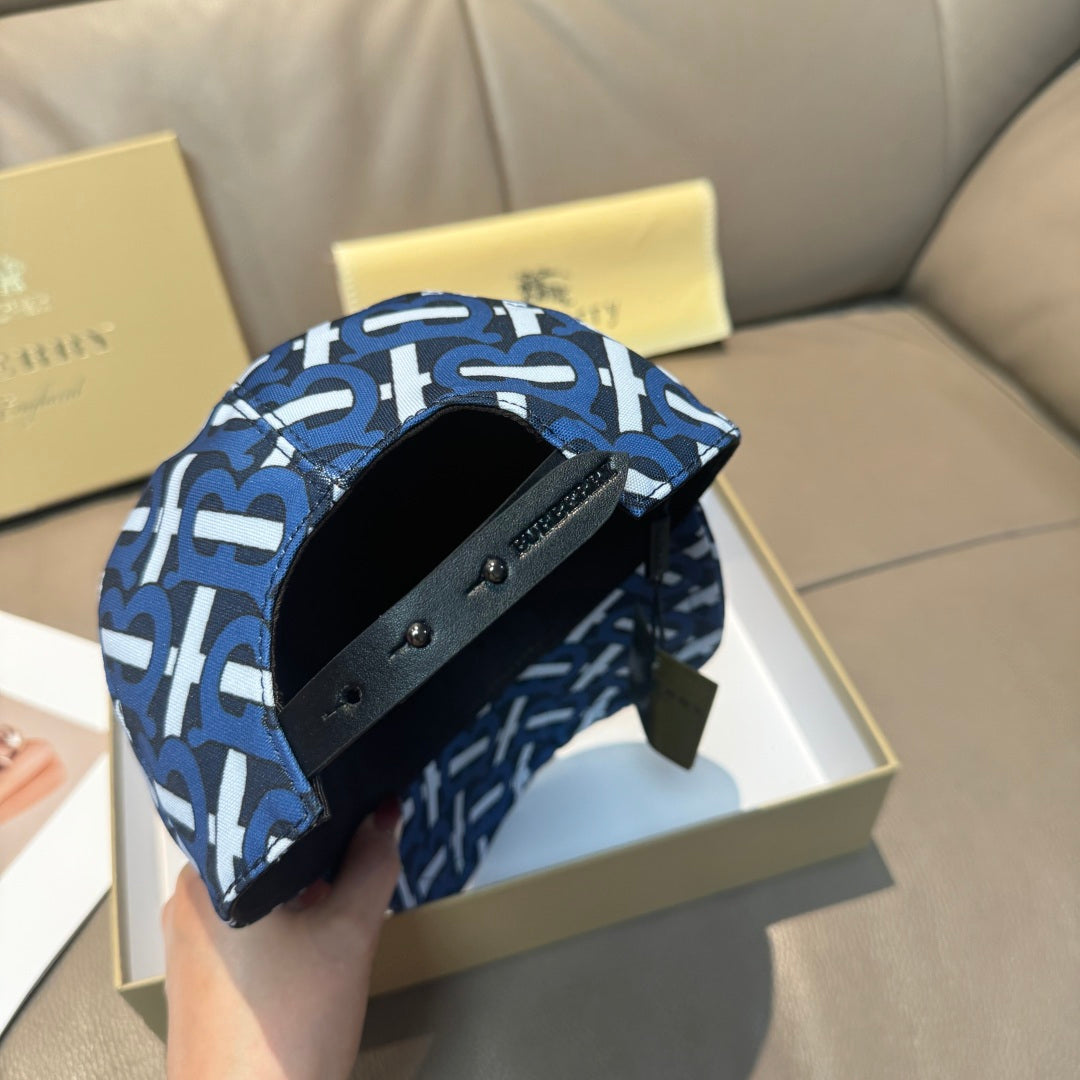 Burberry logo cap with blue and white monogram pattern, interior strap and buckle