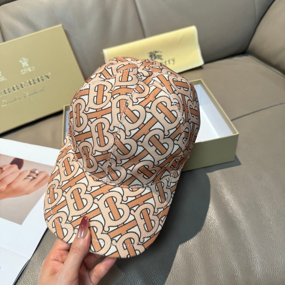 Patterned baseball cap with tan, rust and black logo print, back view