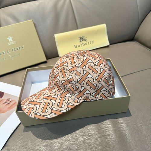 Patterned baseball cap with tan, rust and black logo print and curved brim