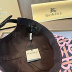 Burberry cap interior with black lining, adjustable strap, and hanging label