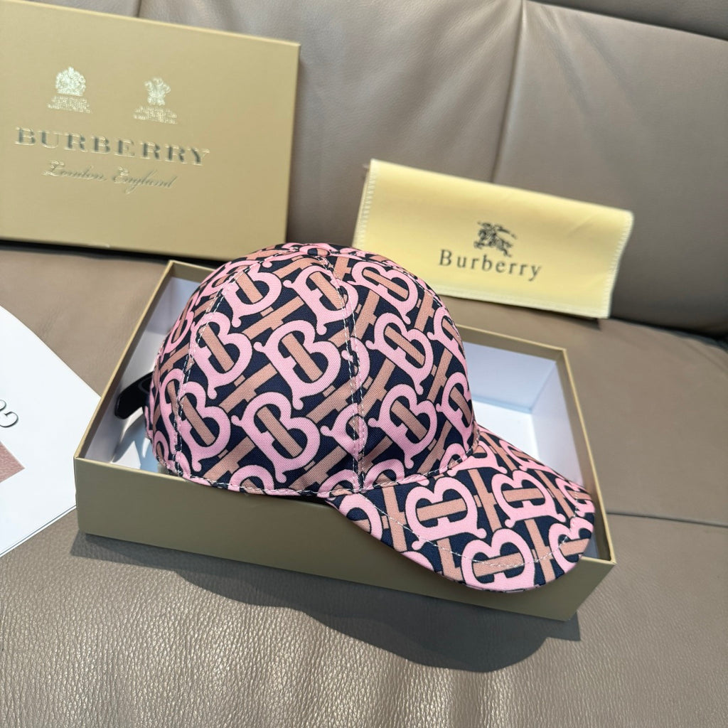 Burberry cap with pink and black monogram pattern, front brim and top panel view