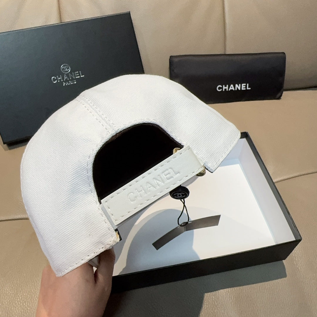 White baseball cap interior showing white Chanel label and drawstring