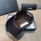 Black Chanel cap interior with adjustable strap and fabric lining