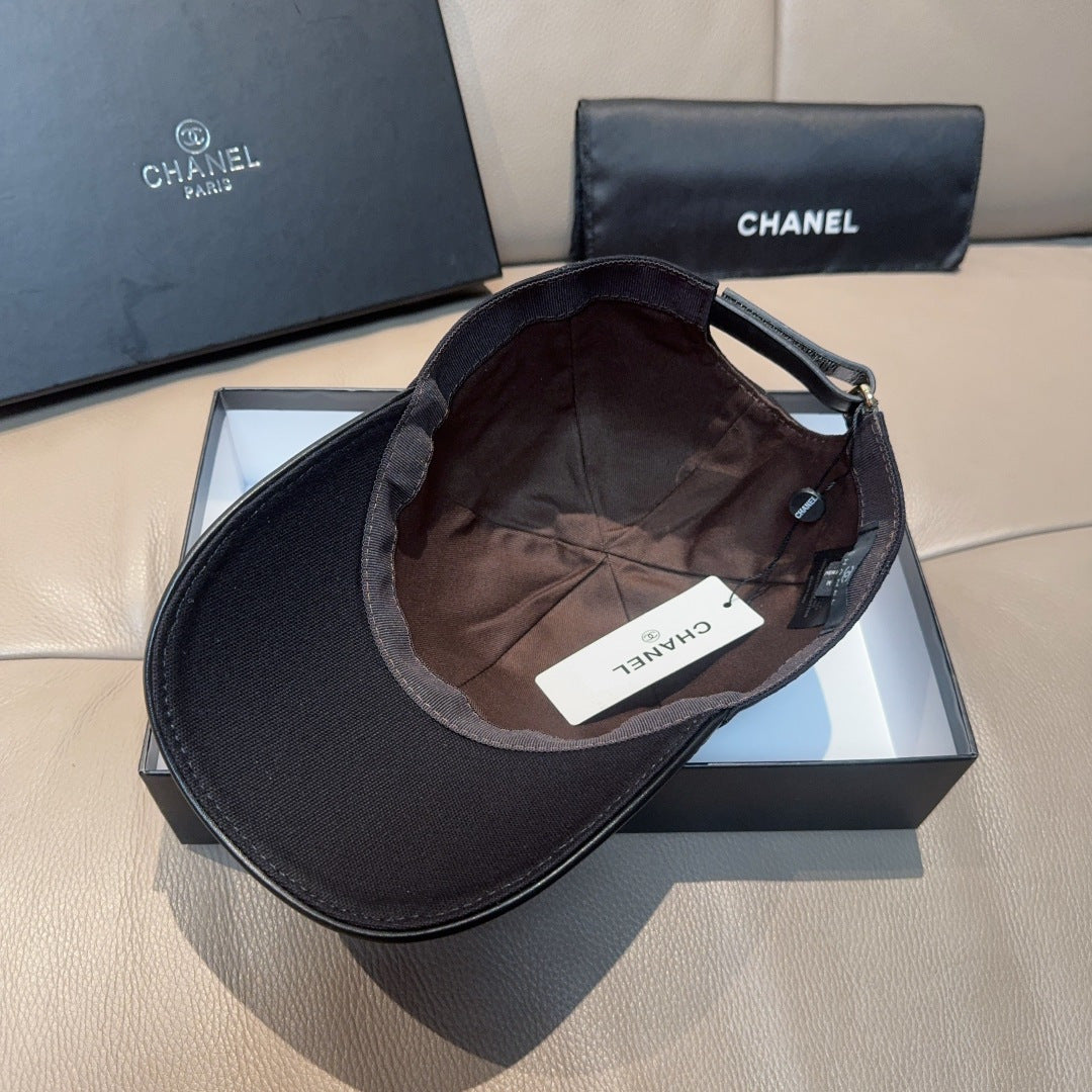Black Chanel cap interior with adjustable strap and fabric lining