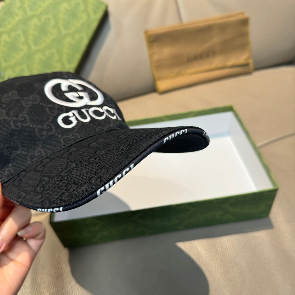 Black Gucci baseball cap, side view with GG monogram fabric and white logo patch.