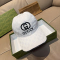 White Gucci baseball cap with front GG logo and stitched brim edge
