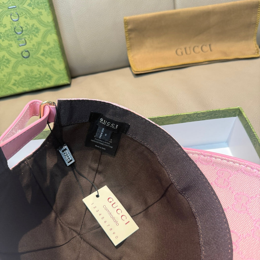 Pink Gucci baseball cap inner brim with hanging tags and black lining