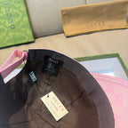Pink Gucci baseball cap inner brim with hanging tags and black lining