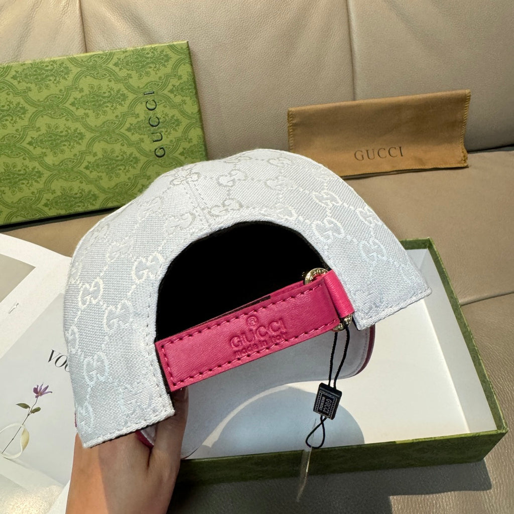 White logo baseball cap with pink strap and black interior lining