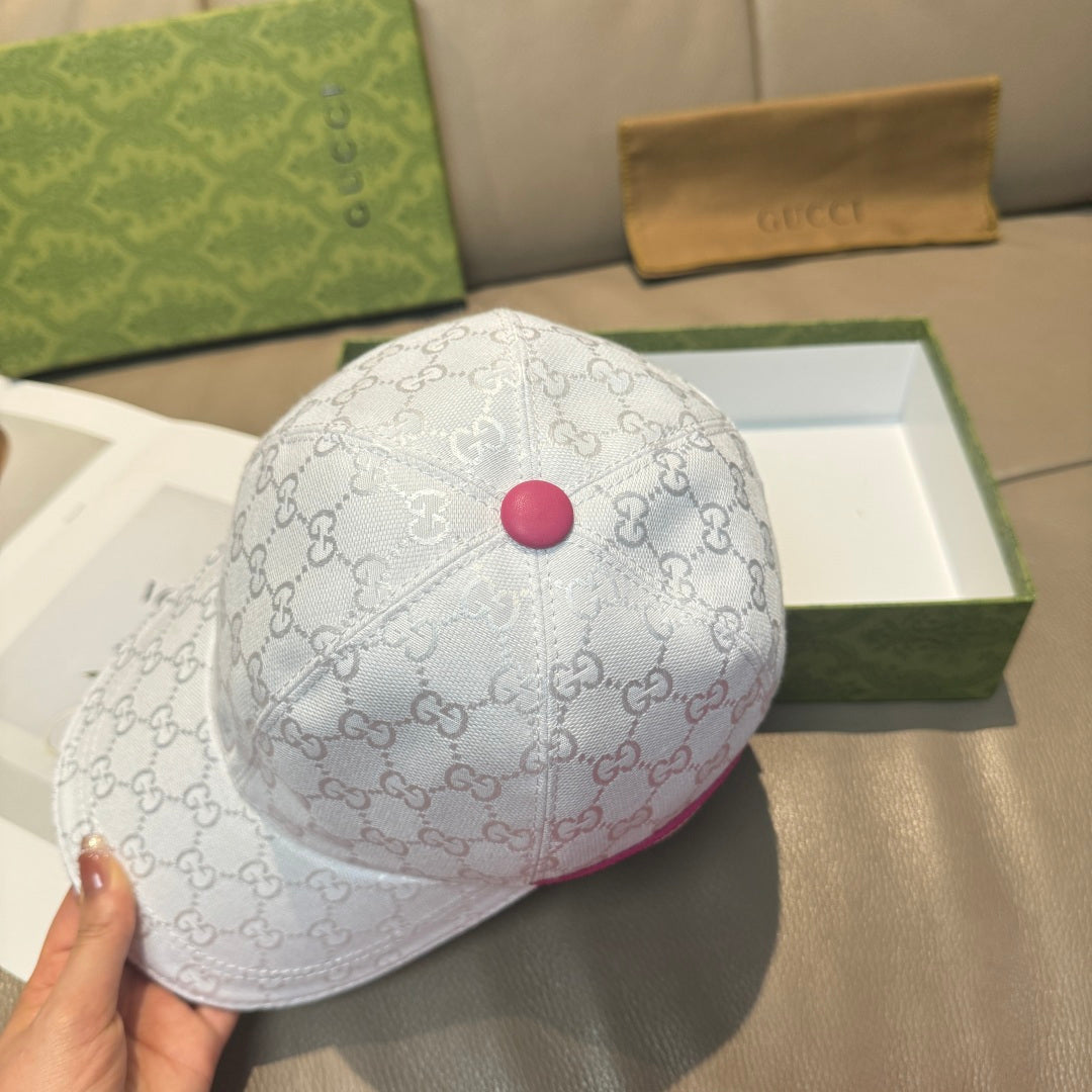 White logo baseball cap with magenta button on crown