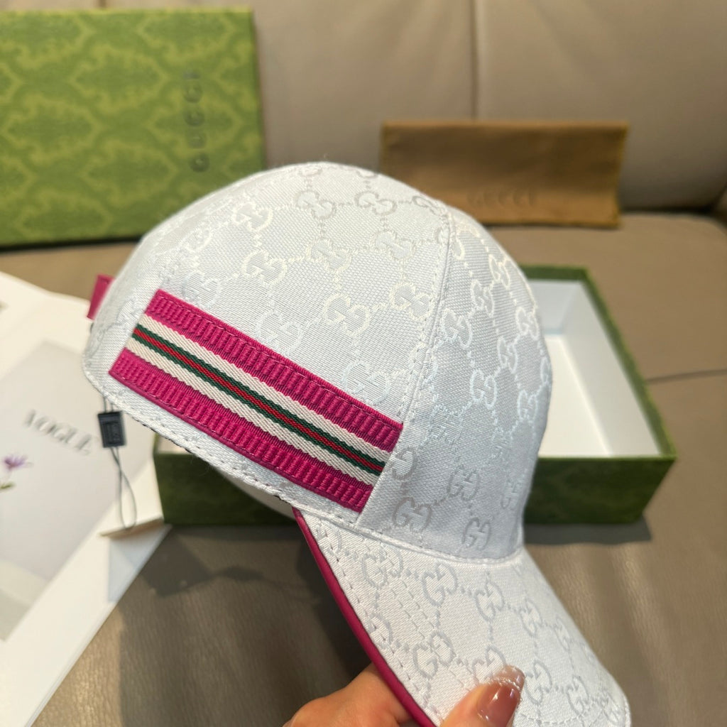White logo baseball cap with magenta stripe and green detail, curved brim