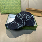 Gucci cap in dark navy denim with light blue GG pattern, front side view.