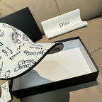 White Dior cap close-up with Christian Dior logo print and curved brim