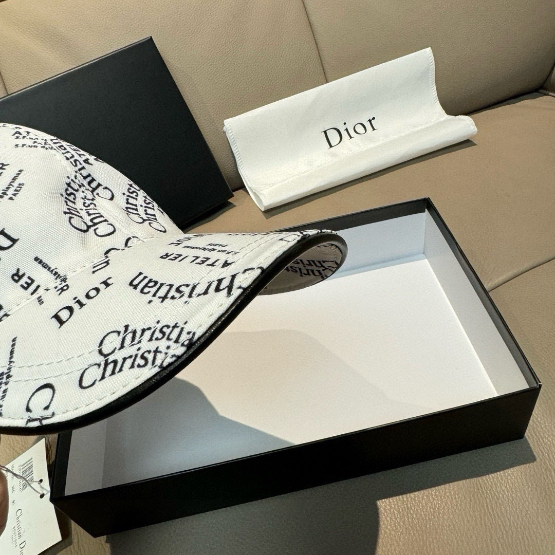 White Dior cap close-up with Christian Dior logo print and curved brim