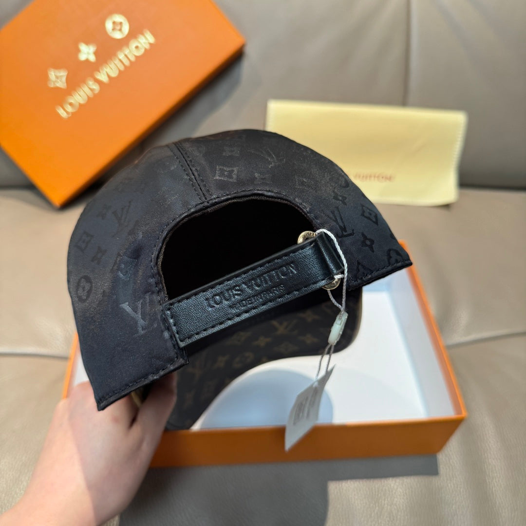 Louis Vuitton cap back view with dark monogram print and adjustable buckle strap.