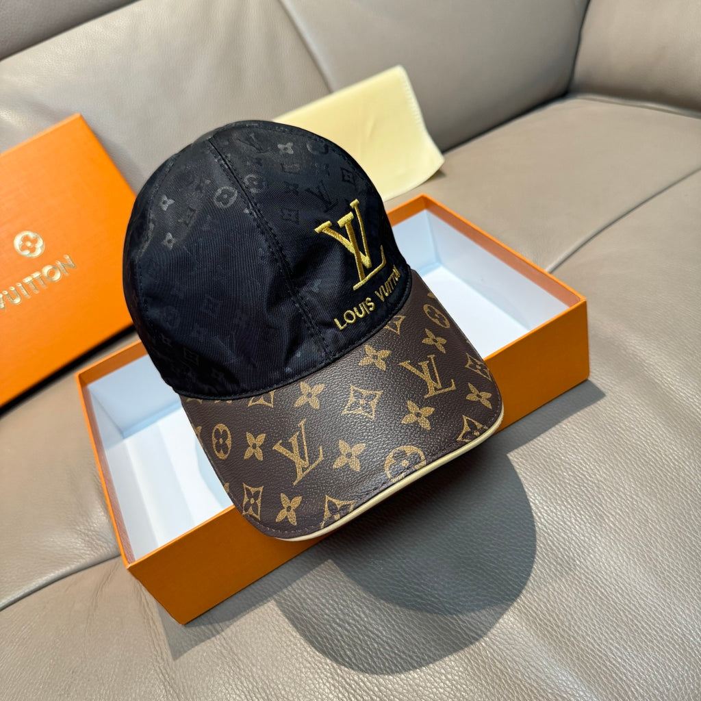 Louis Vuitton cap in dark navy with monogram panels and gold LV logo on front.