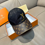 Louis Vuitton cap in dark navy with monogram panels and gold LV logo on front.