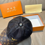 Louis Vuitton cap top view with dark monogram crown and round button at center.