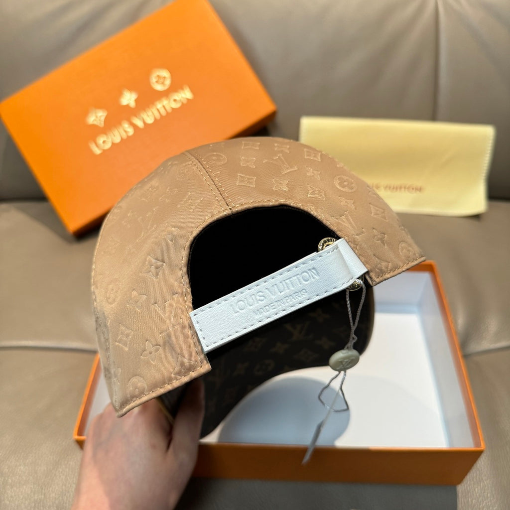 Beige monogram cap interior with black lining and branded strap label