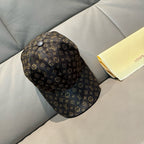 Louis Vuitton monogram cap with curved brim and circular top button.