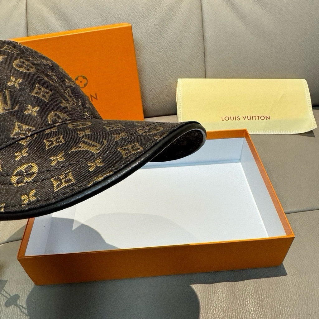 Louis Vuitton monogram cap side view, dark brown/black with stitched strap