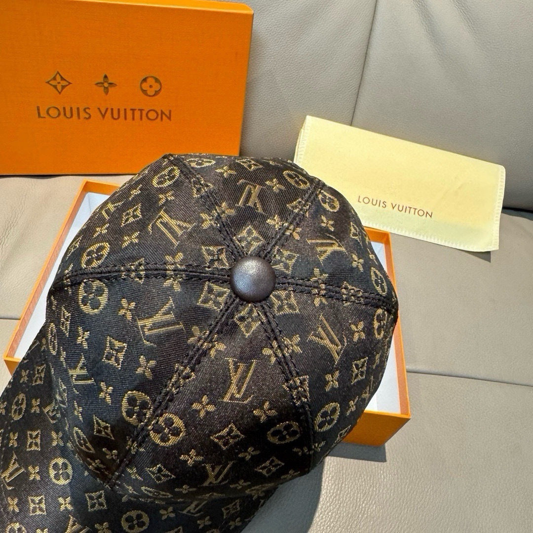 Louis Vuitton monogram cap front view, curved brim and dome top button.