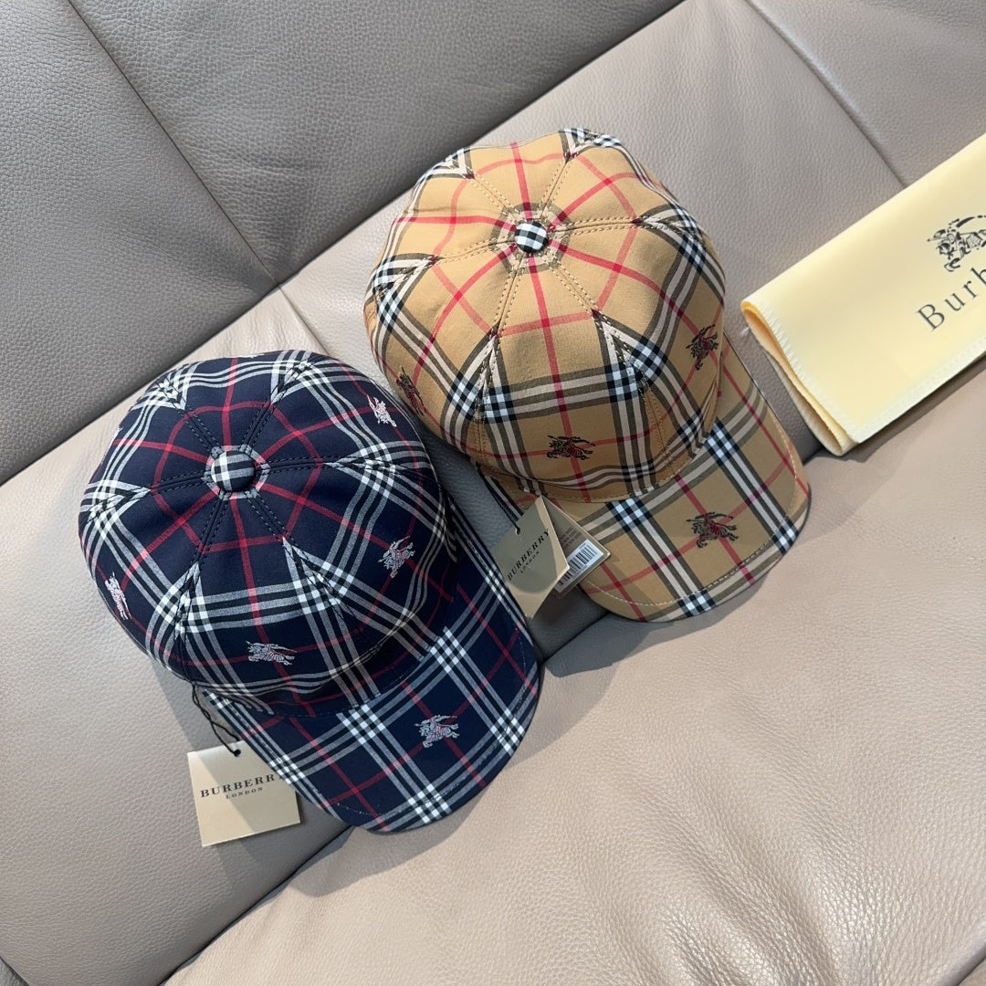 Two plaid baseball caps: navy-red-white and beige-brown with embroidered motifs.