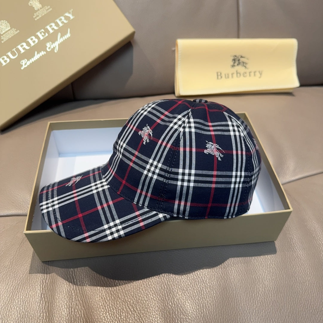 Plaid baseball cap in navy with red and white lines, embroidered motifs on crown.