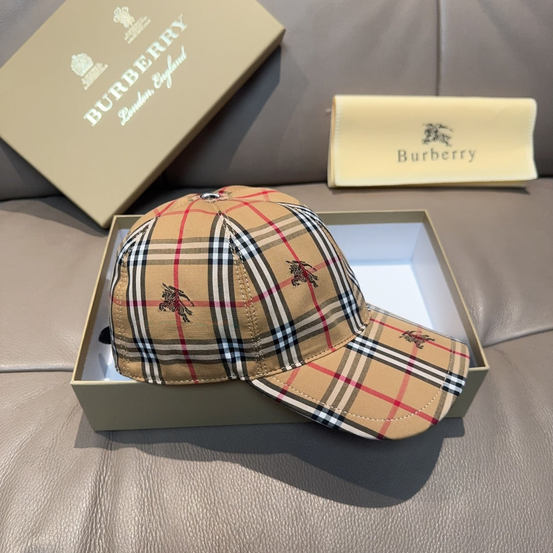 Burberry plaid cap with matching plaid cap in the box, both with curved brims