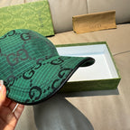 Gucci dark green cap with GG pattern, side profile and brim edge.
