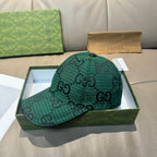 Gucci cap in dark green with GG monogram pattern, side view and brim.