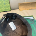Gucci cap interior and lining with dark green GG-pattern exterior.