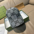 Grey baseball cap with black GG pattern, curved brim and top button