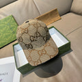 Beige GG monogram baseball cap with curved brim and black eyelet tab
