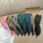 Set of Gucci caps in pink, blue, green, tan, and black with GG pattern.