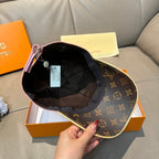 Louis Vuitton cap interior with dark lining and brown monogram exterior, inside view