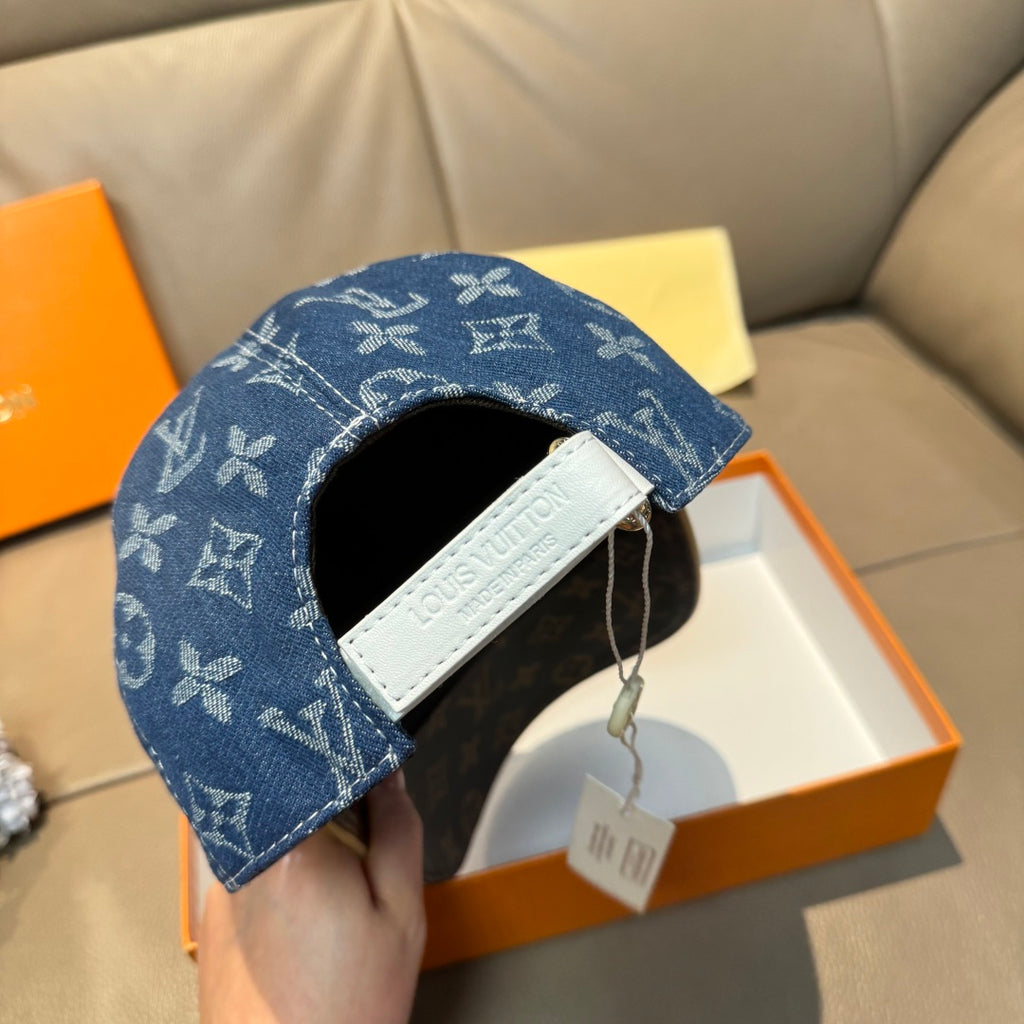 Louis Vuitton denim cap with blue monogram and white logo patch on strap