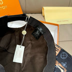 Louis Vuitton baseball cap close-up of interior strap with LV branding and hanging tag.