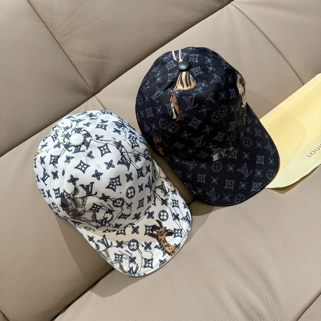 Louis Vuitton baseball cap pair: light and dark navy monogram styles with animal patches.