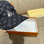 Louis Vuitton baseball cap in dark navy with monogram print and animal graphic near crown.