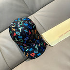 Black baseball cap with colorful graffiti-style letters and numbers, adjustable cap shape.