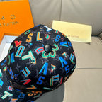Black baseball cap top with circular button and multicolor letter and number pattern.