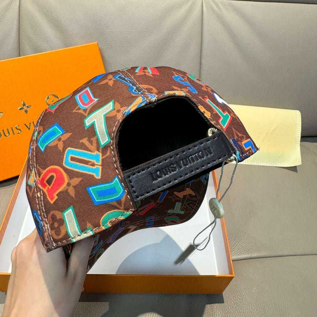 Louis Vuitton cap side view with black strap and brown multicolor letter pattern