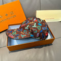 Louis Vuitton cap in brown with multicolor letter pattern, curved brim, and round top button