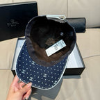 Chanel denim baseball cap interior view showing lining and stitched CC pattern